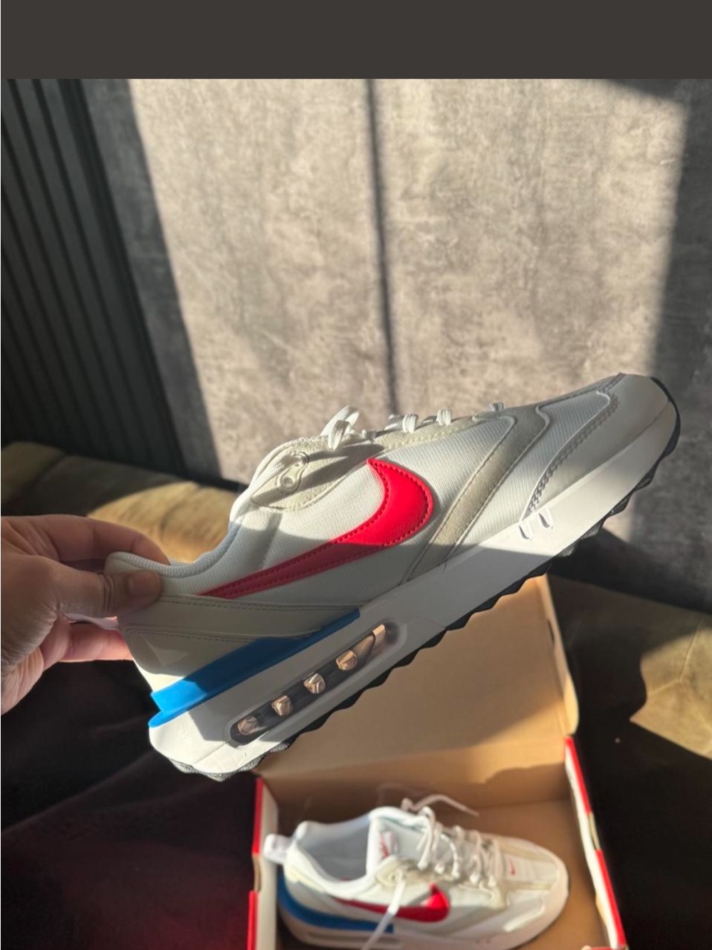 Nike White Sneaker with Red Swoosh and Blue Heel Accent